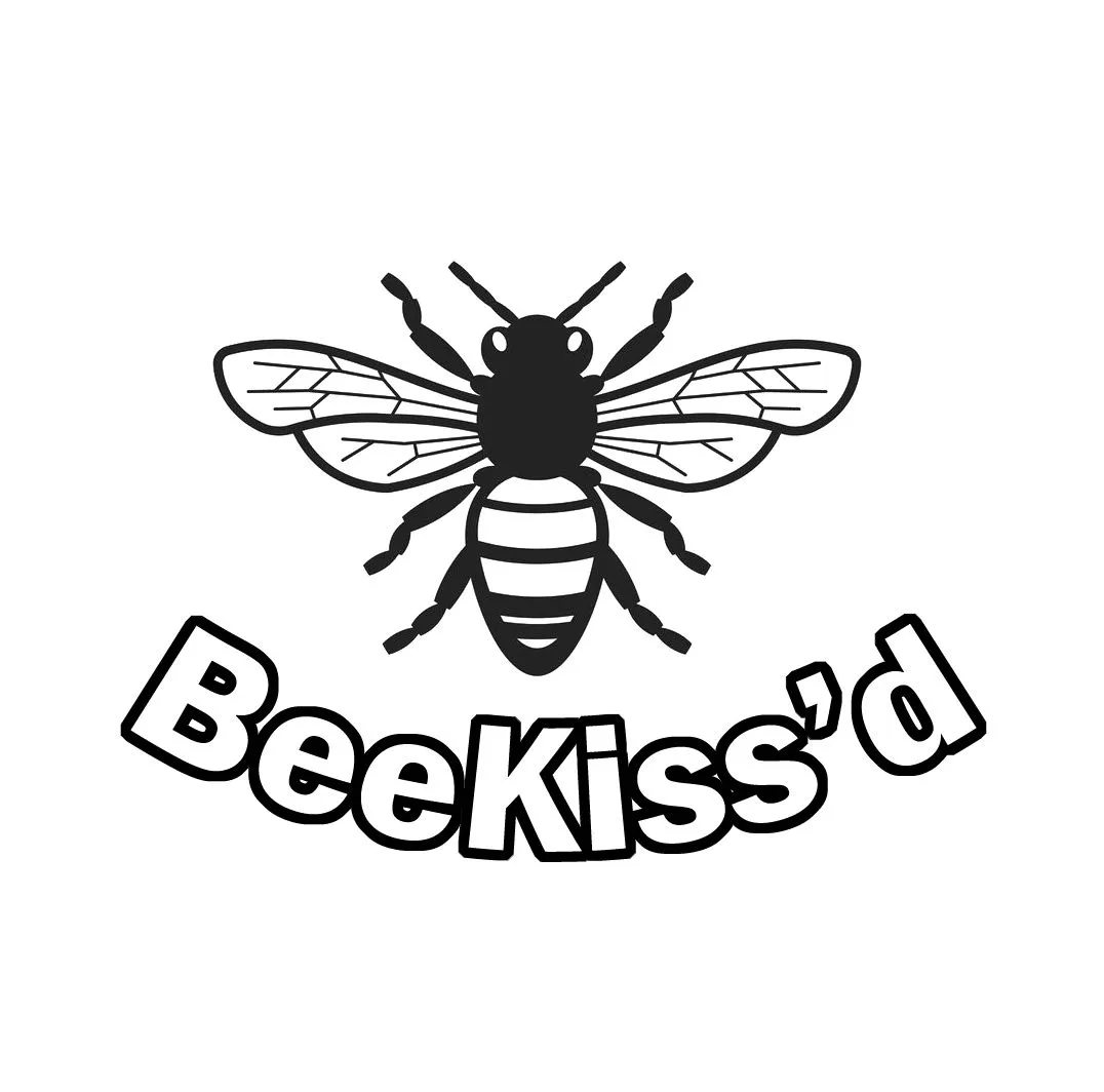 BeeKiss'd logo on a wooden pot